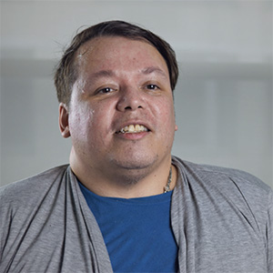 Portrait of Julius Ybañez Towers wearing a grey top