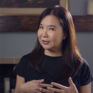 Portrait of Maisie Soentantyo gesturing while speaking